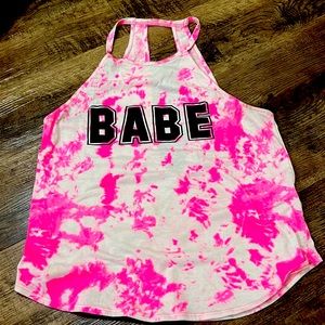 I’m selling a pink and white shirt that says babe